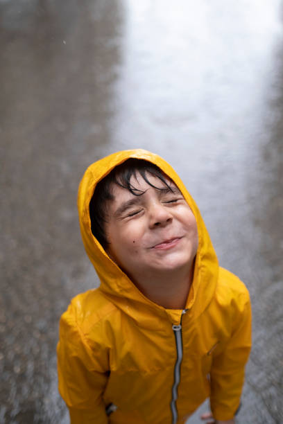 happy child playing with a water hose