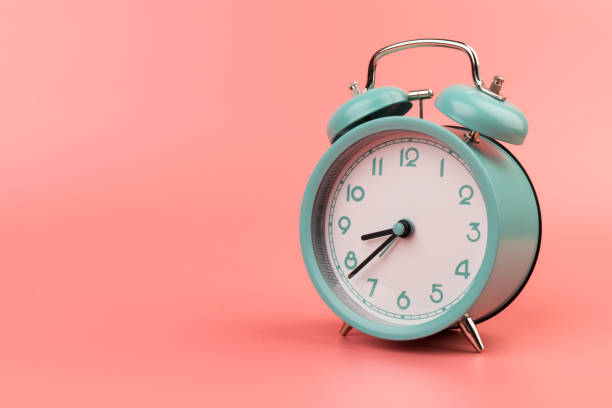 istock Old clock isolated on a pink background with space for text. Concept of time 1317763809