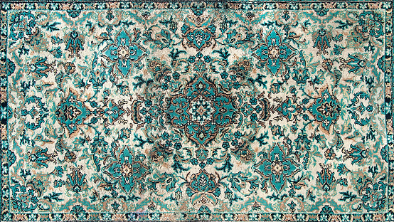 La textura de una alfombra persa, un adorno abstracto. Patrón de Mandala redondo, textura tradicional de tela de alfombra de Oriente Medio. Beige verde lechoso turquesa, verde claro, marrón. motivos vintage, orientales photo