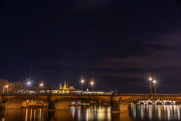 istock Night shot of Prague with Vltava river 1317769471
