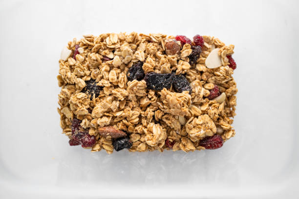 istock Abstract view of granola breakfast cereal inside plastic tub 1317769481