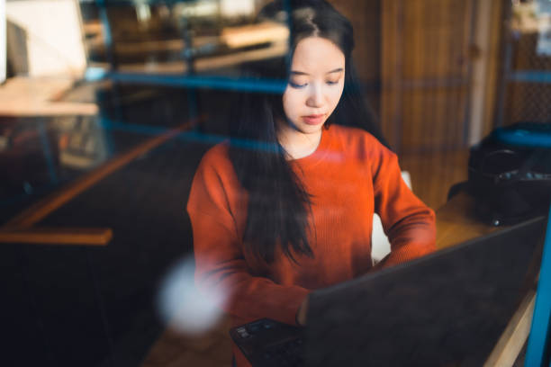 istock University student collecting information from laptop. 1317770449