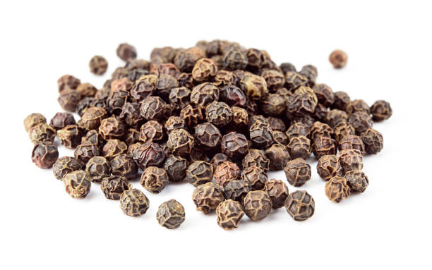 istock Peppercorns macro. Black Pepper isolated on white. Peppercorn on white background. With soft focus. 1317770809