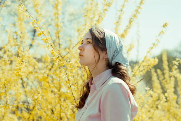 Beautiful polish brunette on spring flowers background