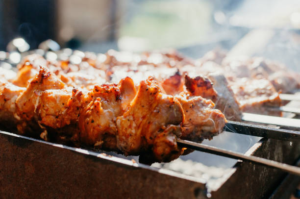 istock Cooking marinated pork kebabs on the grill. Fried pork kebabs on an open fire. Grill cooking season. 1317772214