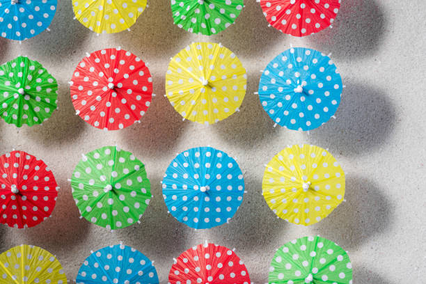 istock Beach Umbrella Pattern View From Above on Sandy Beach. Still Life Art 1317772720