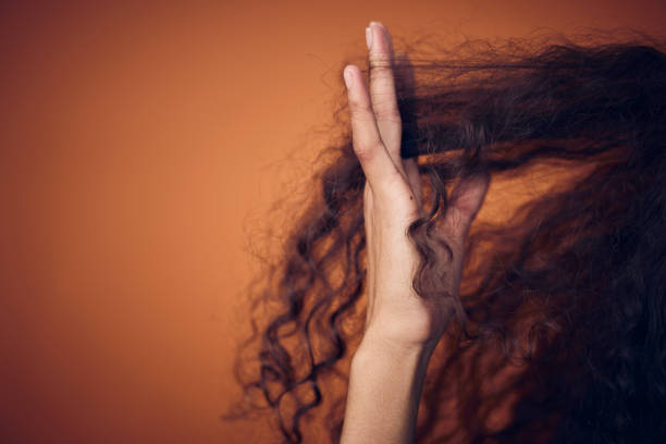 Cropped shot of a woman running her fingers through her curls I don't need a comb natural hair stock pictures, royalty-free photos & images