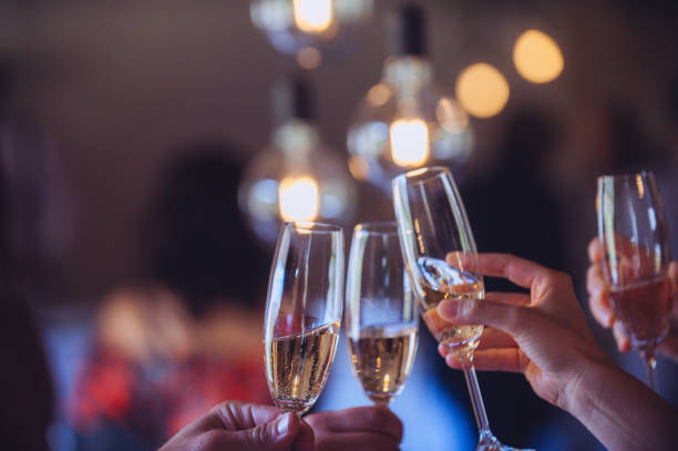 istock Champagne flutes celebratory Toast party with string lights 1317775870