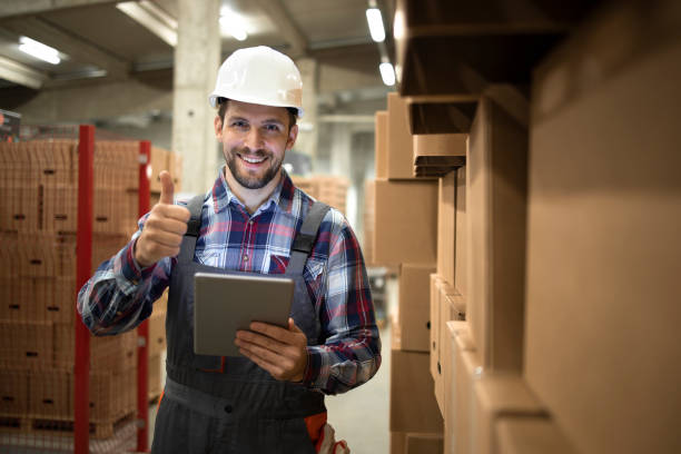 istock Portrait of warehouse supervisor successfully organizing goods distribution and shipment from large storage room to the market. 1317777869