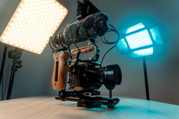 Camera with external monitor, mic, and handheld film-making rig. Full frame camera with external monitor, mic, and handheld film-making rig. cinematography stock pictures, royalty-free photos & images