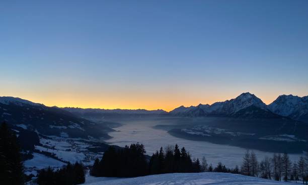 View over the Inn Valley with fog on 1 January towards Innsbruck Wattens Oberland from pillberg near the Kellerjoch Hecher Arbeser Kuhmesser Zillertal above Schwaz Pill Vomp in Tyrol Winter in the Alps inn river stock pictures, royalty-free photos & images