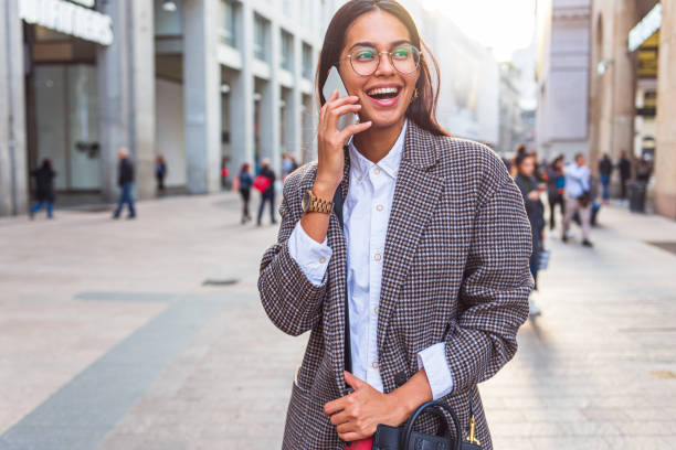istock Young woman elegantly dressed walks the city 1317780297