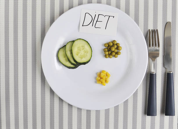 istock Conceptual image of diet theme. Plate with some food. 1317780440