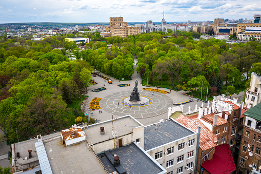 Taras Shevchenko monument at Sumskaya street in Kharkov, Ukraine. Aerial view with green spring trees in park.Sculptor is Matthew Manizer, architect is Joseph Langbard. Opening celebration of the monument took place on March 24, 1935
