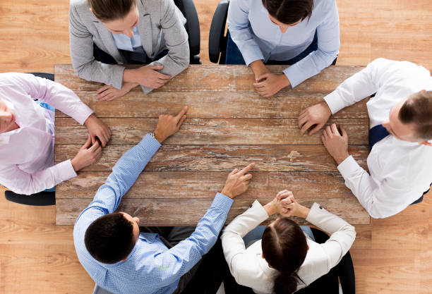 istock close up of business team sitting at table 1317782482