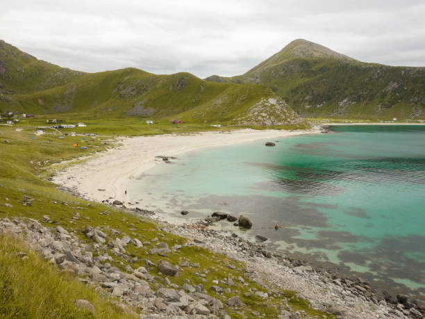 istock turquoise blue beach and mountains in the background Norway 1317782965