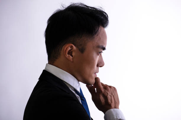 istock Side view Silhouette of  thinking businessman. 1317783090