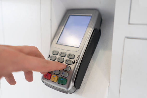 istock person's hand enter password and push buttons to make a payment 1317785627