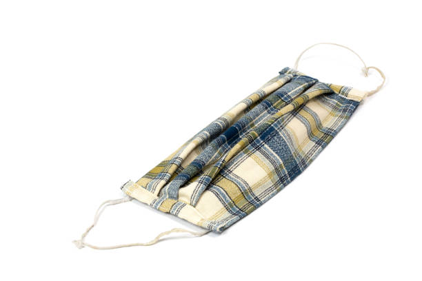 istock Face Mask of plaid fabric on a white background 1317795359