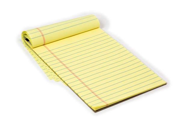 istock Yellow Note Pad with ruled paper on a white background. 1317795486