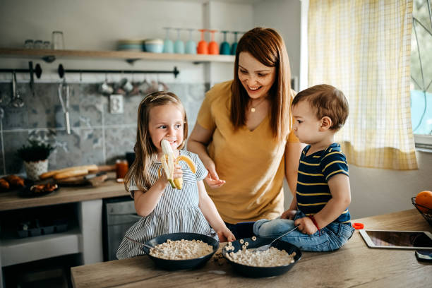 istock Family gathered in the kitchen 1317796621