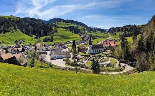 mountain village near zurich switzerland. Toesstal with a view of the snowy mountains. Springtime in backcountry. Swiss