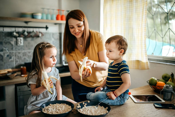 istock Family gathered in the kitchen 1317796701