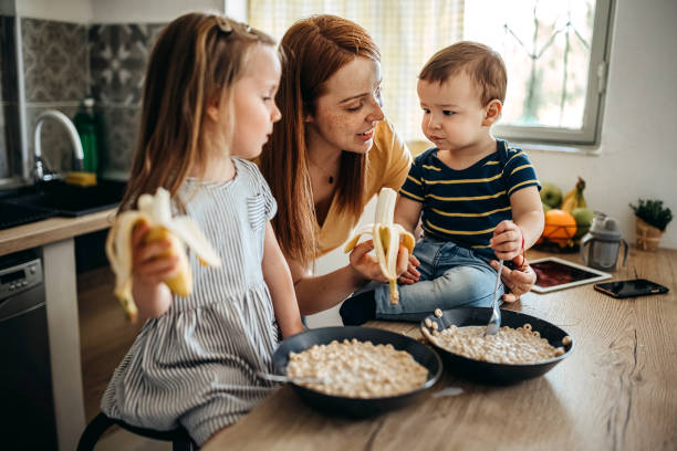 istock Family gathered in the kitchen 1317796702
