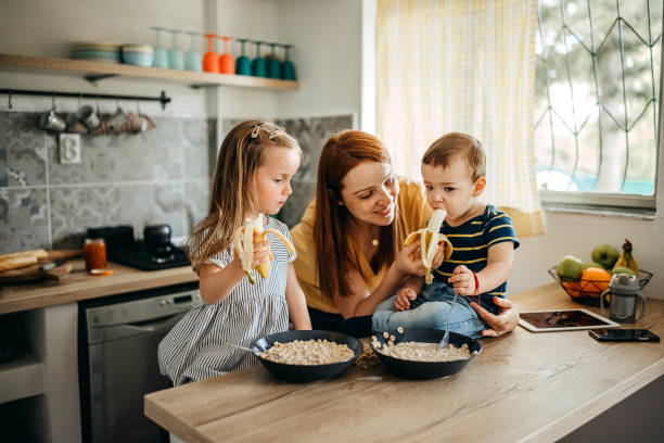 istock Family gathered in the kitchen 1317796707