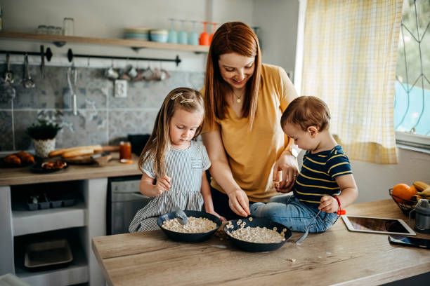 istock Family gathered in the kitchen 1317796711