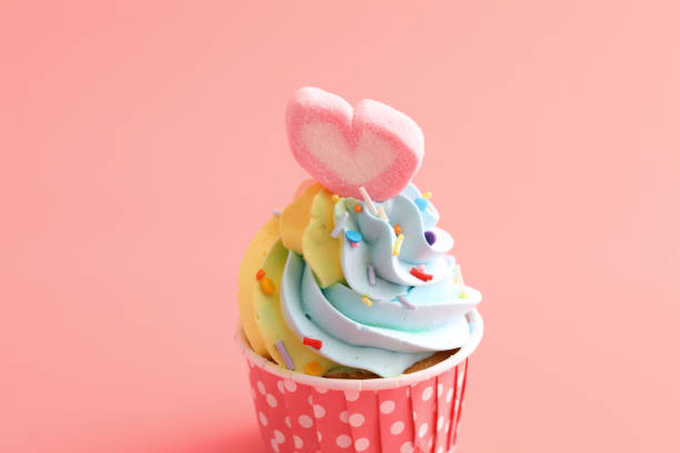istock colorful cupcake isolated in pink background 1317796819