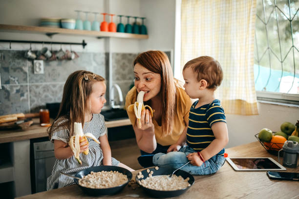 istock Family gathered in the kitchen 1317796897