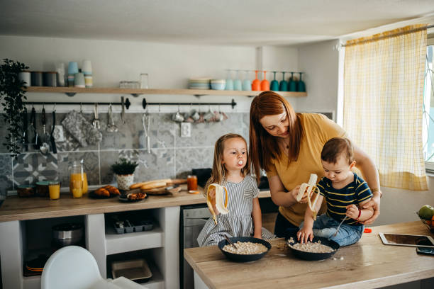 istock Family gathered in the kitchen 1317796946