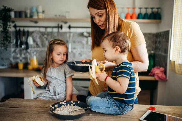 istock Family gathered in the kitchen 1317797022