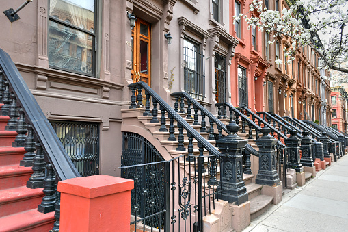 View of Brownstone buildings in Harlem in Manhattan, New York City.