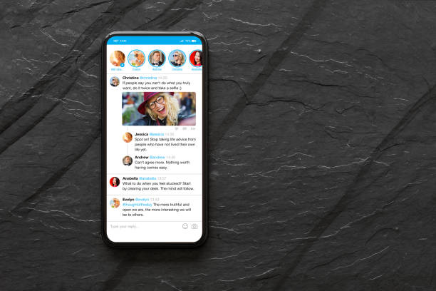 istock Mobile phone with sample social media microblogging app on the screen 1317797189