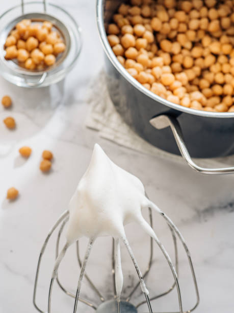 istock Whipped chickpea aquafaba on planetary mixer whisk 1317797342