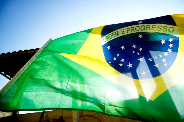 istock Brazilian flag in blue sky. 1317798579
