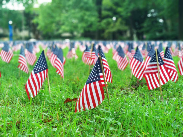 9/11 Memorial Display of American flags for each person that lost their life in the 9/11 terrorist attacks. memorial event photos stock pictures, royalty-free photos & images