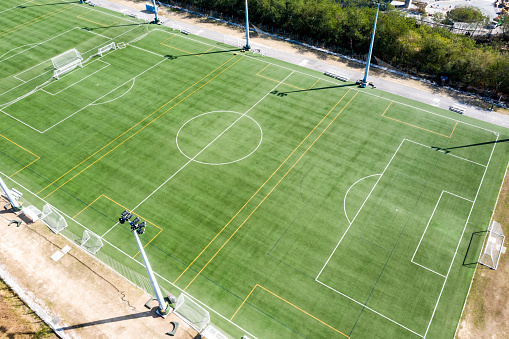 Drone View Of Street Soccer Court. Outdoor sport ground with green surface for playing football or soccer