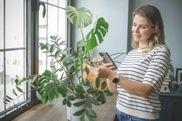 attractive middle aged woman with Potted Plant