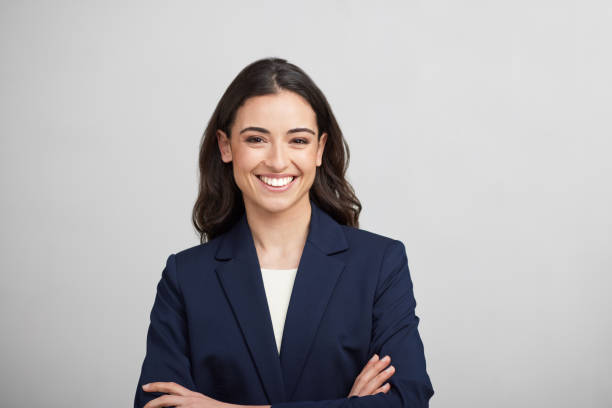 one businesswoman studio portrait looking at the camera. - young women one young woman only smiling cheerful imagens e fotografias de stock