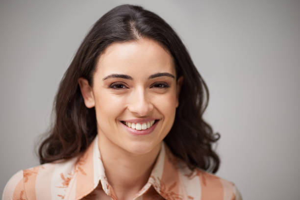 istock One woman smiling and looking at the camera. 1317804606