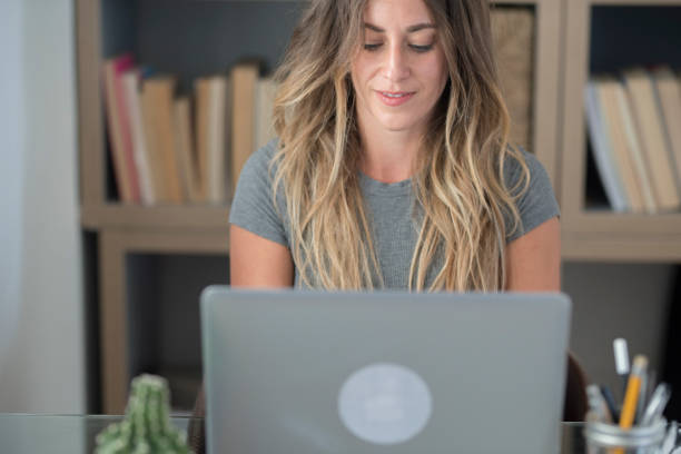 istock Video conference call in online smart working remote work job home office activity with pretty middle age woman enjoying online modern technology and internet connection to be free - businesswoman 1317806641