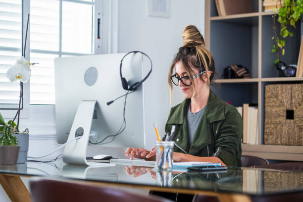 istock Video conference call in online smart working remote work job home office activity with pretty middle age woman enjoying online modern technology and internet connection to be free - businesswoman 1317807393