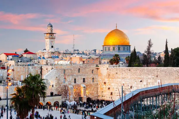 Jerusalem, Israel at the Western Wall and Dome of the Rock at dusk in the old city.