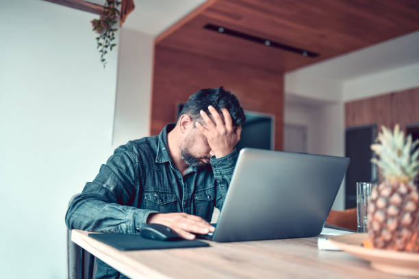 istock Stressed Male Trying To Finish Work On Laptop 1317808918