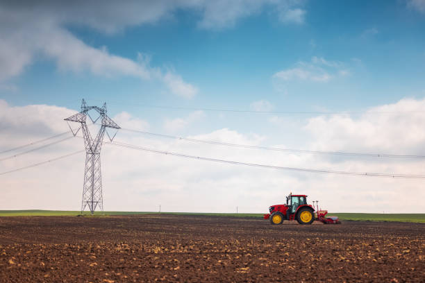 istock Farmer in tractor preparing farmland with seedbed for the next year 1317809011