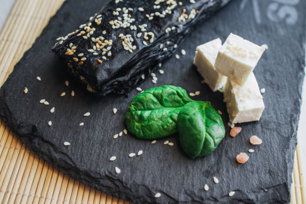 Baked cheese pie with spinach and sesame. Bulgarian butter banitsa for breakfast, sushi style