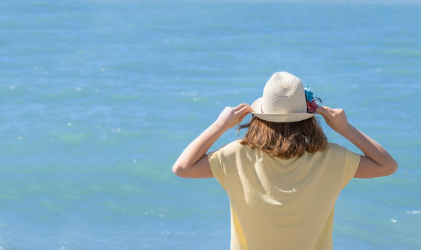 istock Girl looking at the sea 1317810136